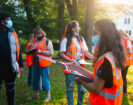 Shape My City students with clipboards