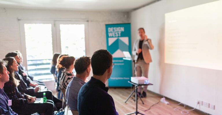 Presentation to an audience in venue space.